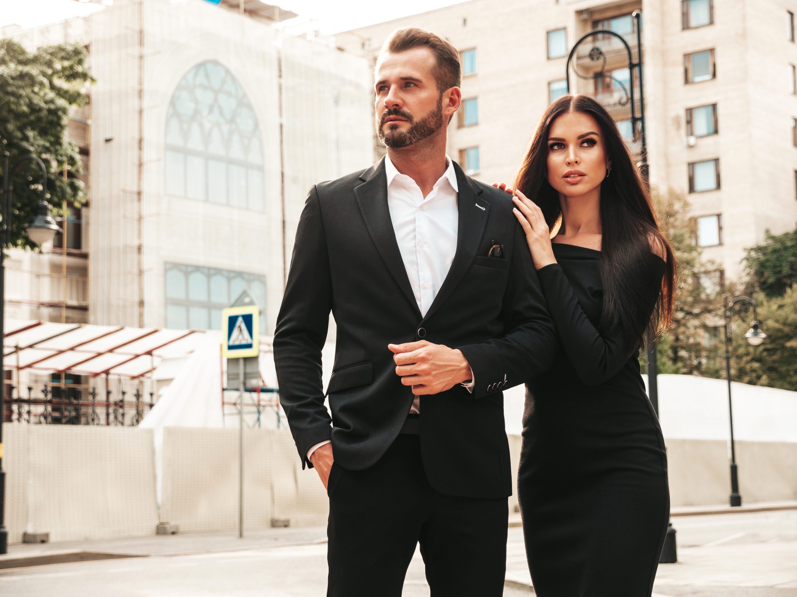 beautiful fashion woman her handsome elegant boyfriend suit sexy brunette model black evening dress fashionable couple posing street europe brutal man his female outdoors