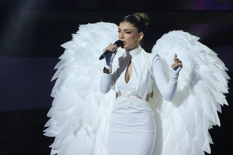 Spectacle on stage: Contestant wore huge angel wings and sang one of the saddest ballads (VIDEO)